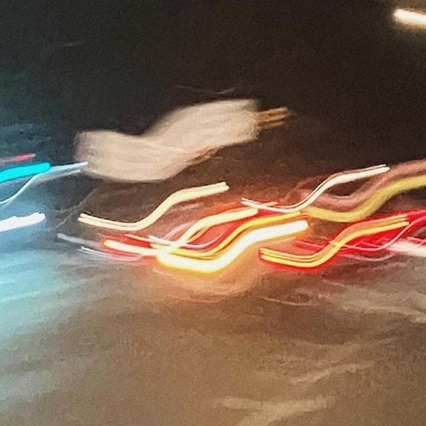 Sasha’s avatar: blurred city lights at night